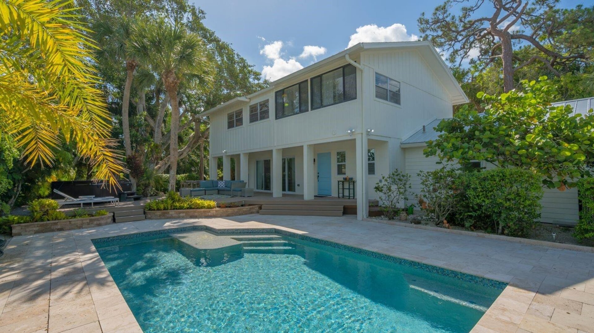 Back view of home with pool