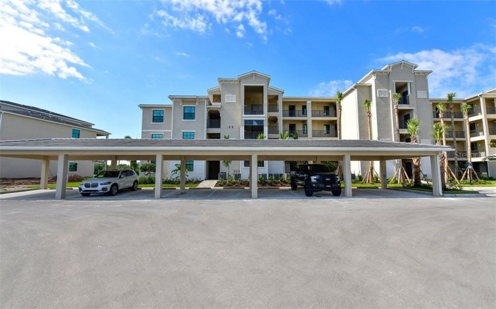 Exterior of building with covered parking