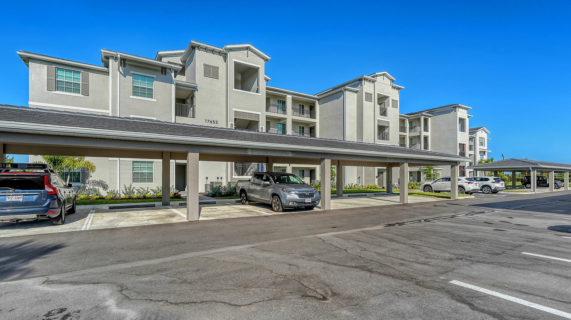 Exterior of building with covered parking